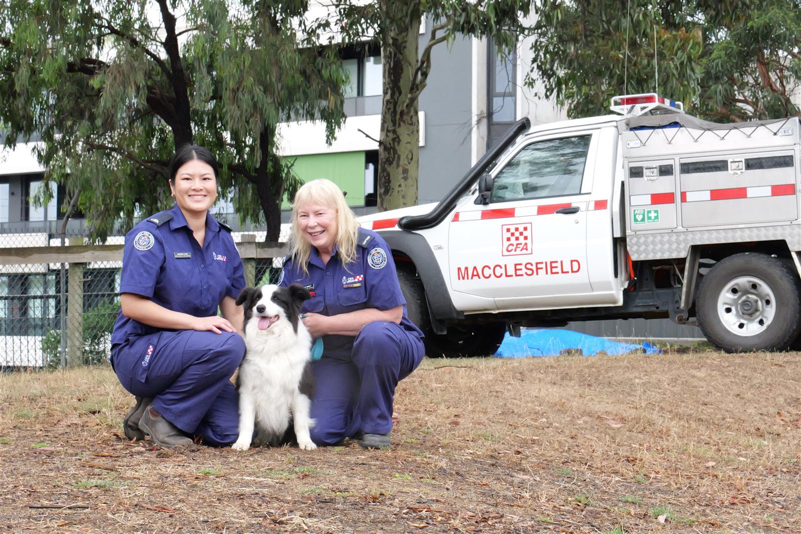 Macclesfield Fire Brigade member Kristina Yang and Captain Sharon Merritt with Archie the dog